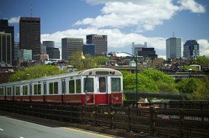 Red line train with Boston skyline