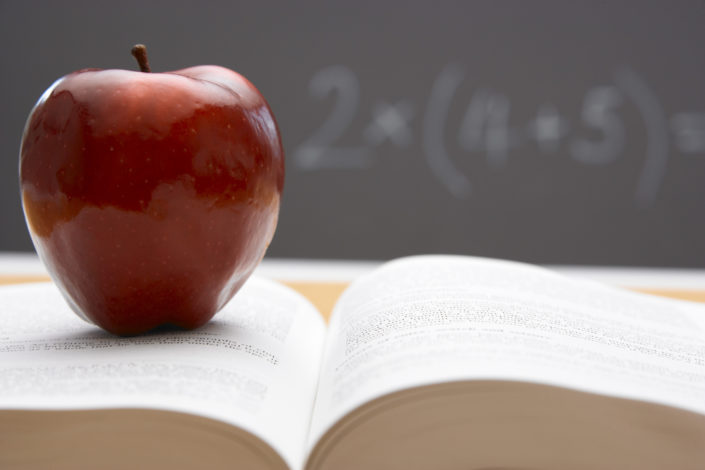 apple on open book
